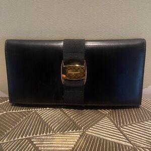 Black Ferragamo wallet with Gold Accent